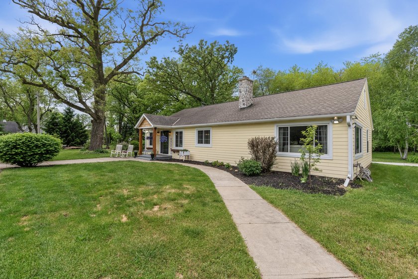 Set on nearly an acre in a close-knit lake community, this - photo 2