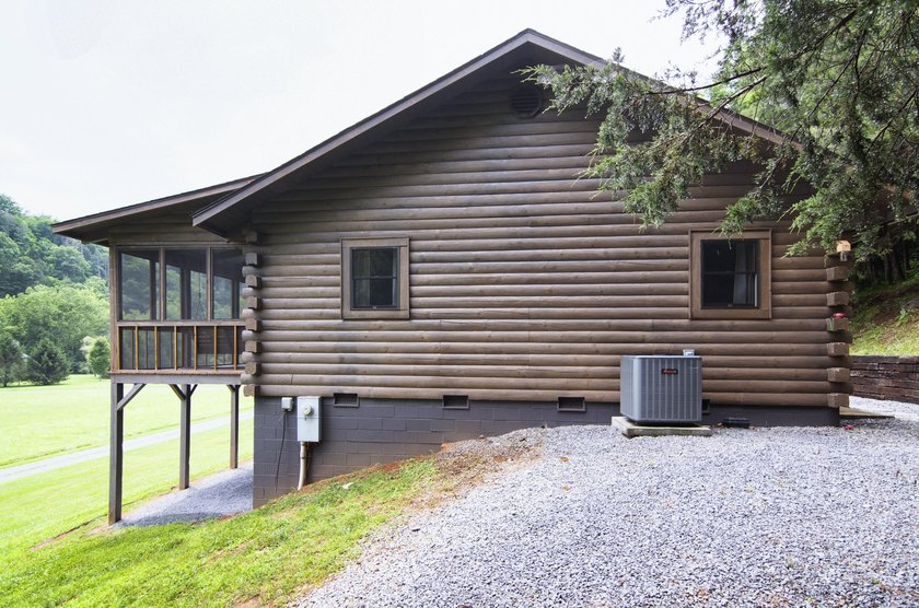 Welcome to this beautifully renovated log home tucked away in a - photo 49