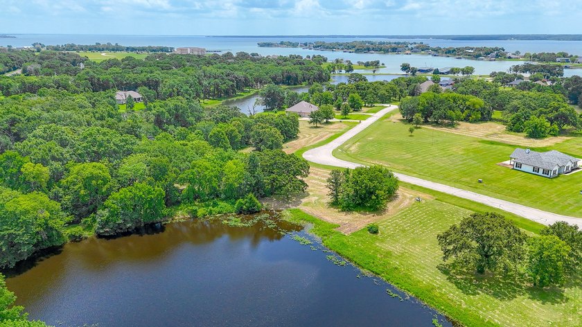 Beautiful 1 acre lot with pond in a gated community. Welcome to - photo 31