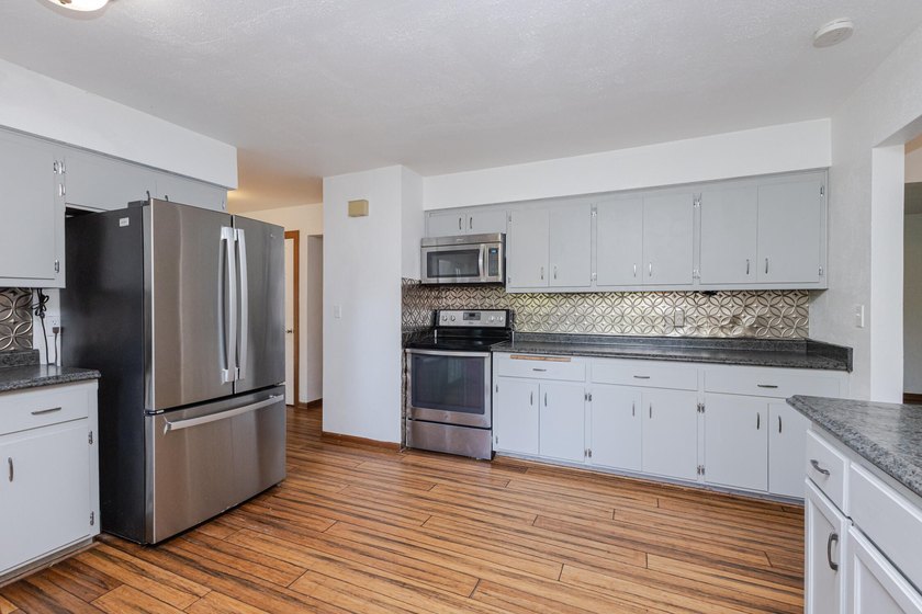 Enjoy the perfect blend of space, updates, and location on this - photo 3