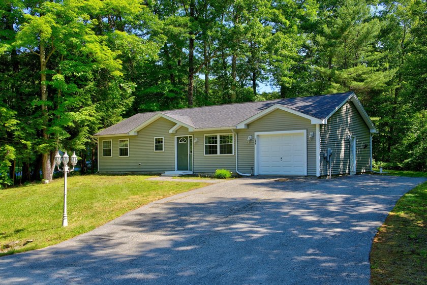 Quality-built and low maintenance, this charming two-bedroom - photo 2