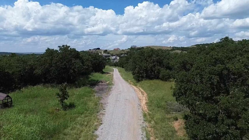 This triple lot in lively Medicine Park is open to commercial or - photo 3