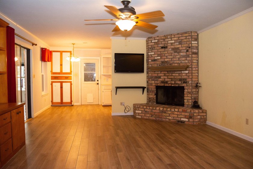 This 3/2/2 home offers incredible potential and plenty of space - photo 2