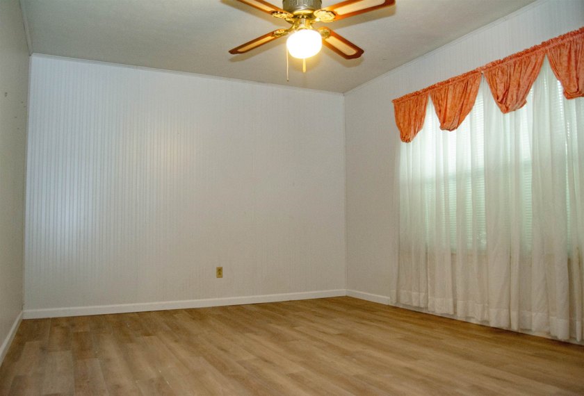This 3/2/2 home offers incredible potential and plenty of space - photo 3