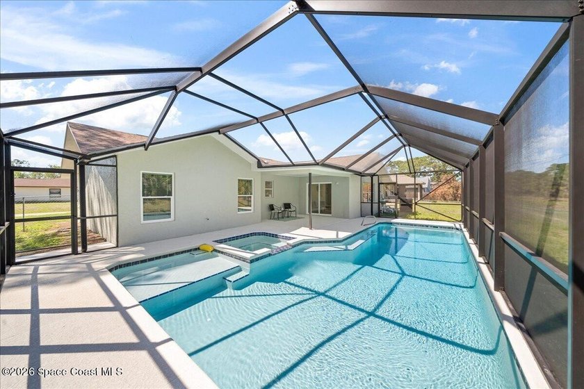 Brand New Roof! Welcome home to this beautifully renovated pool - photo 3
