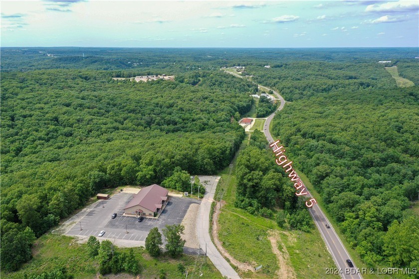 This expansive 5-acre commercial lot boasts exceptional frontage - photo 2