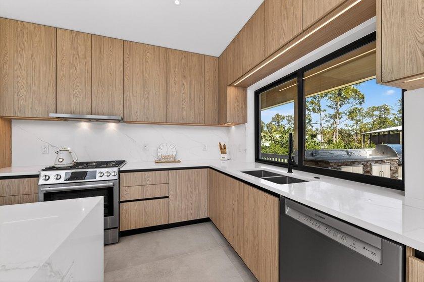 This exceptional new construction estate offers a refined blend - photo 12