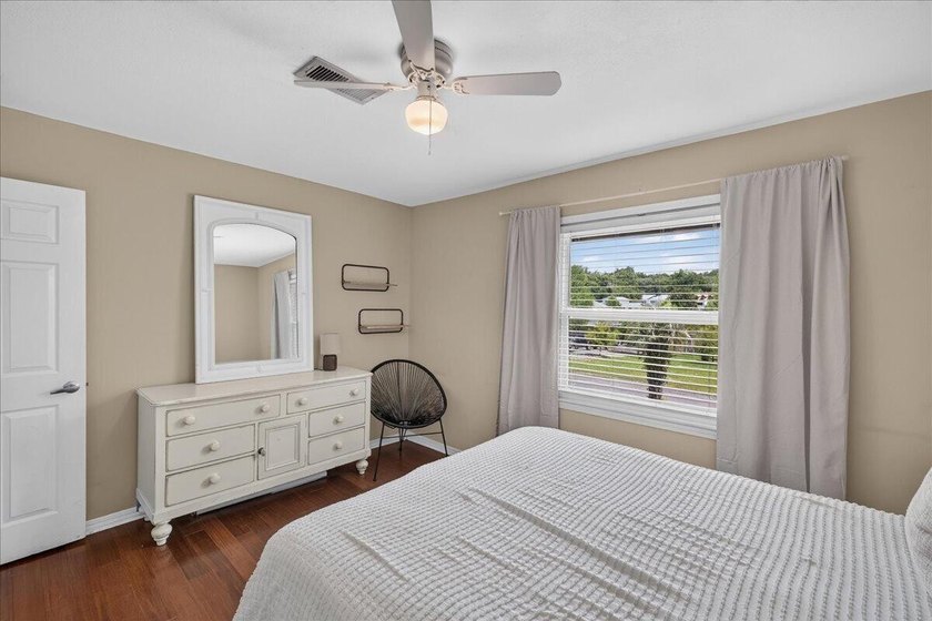 Nestled on a spacious double lot of just over half an acre, this - photo 32