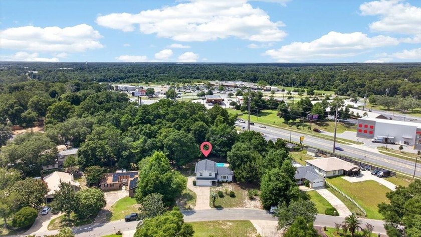 Nestled on a spacious double lot of just over half an acre, this - photo 45