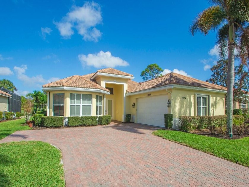 This pool home features a 2022 roof, laminate flooring - photo 2