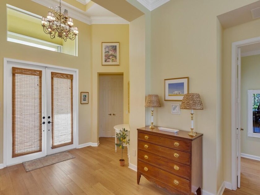 This pool home features a 2022 roof, laminate flooring - photo 3
