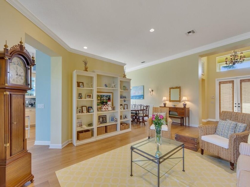 This pool home features a 2022 roof, laminate flooring - photo 6