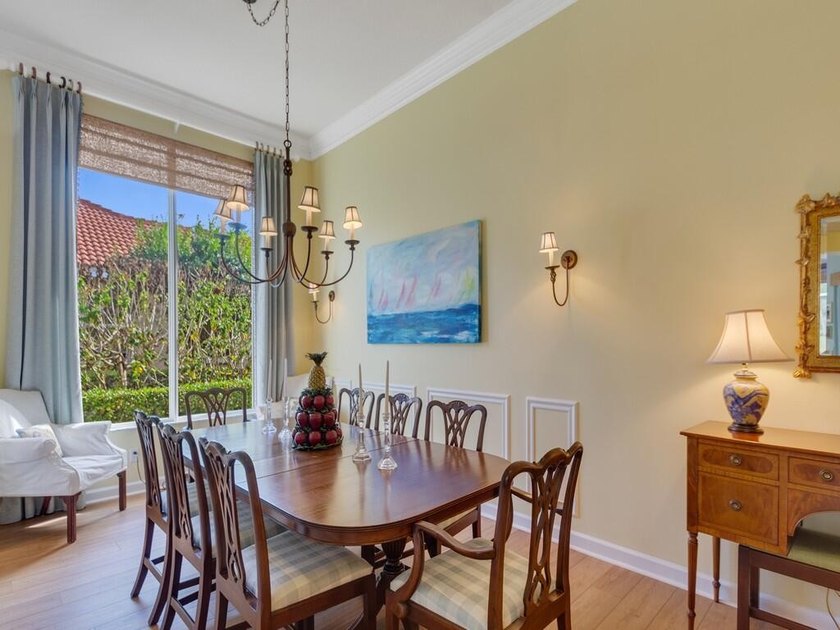 This pool home features a 2022 roof, laminate flooring - photo 9
