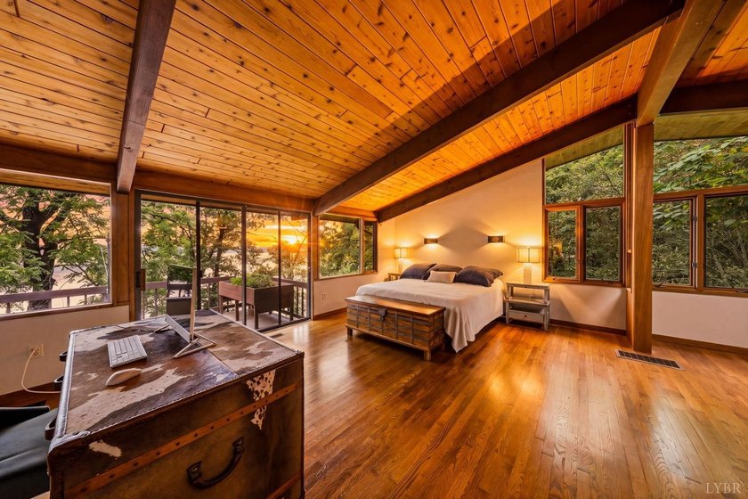 Nestled at the end of a private drive, this lakeside sanctuary - photo 11