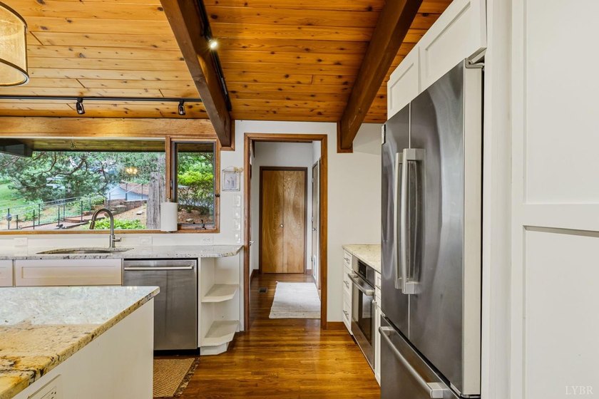 Nestled at the end of a private drive, this lakeside sanctuary - photo 25