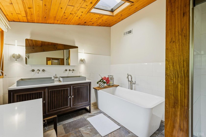 Nestled at the end of a private drive, this lakeside sanctuary - photo 41