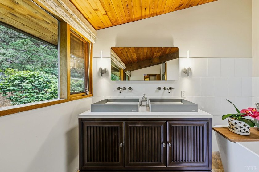 Nestled at the end of a private drive, this lakeside sanctuary - photo 42