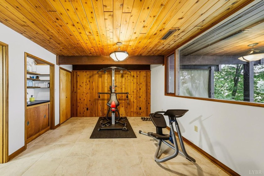 Nestled at the end of a private drive, this lakeside sanctuary - photo 48