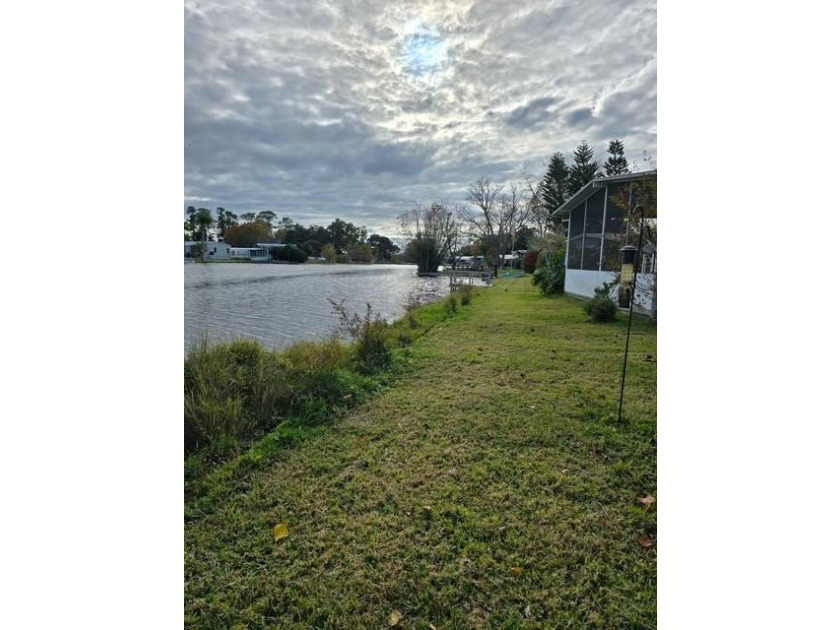 Live on the water ! Lovely screened in porch all year views of - photo 5