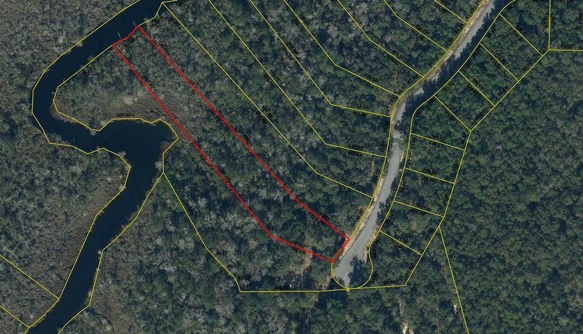 Build your dream home on this 1.5 acre waterfront lot in the - photo 2