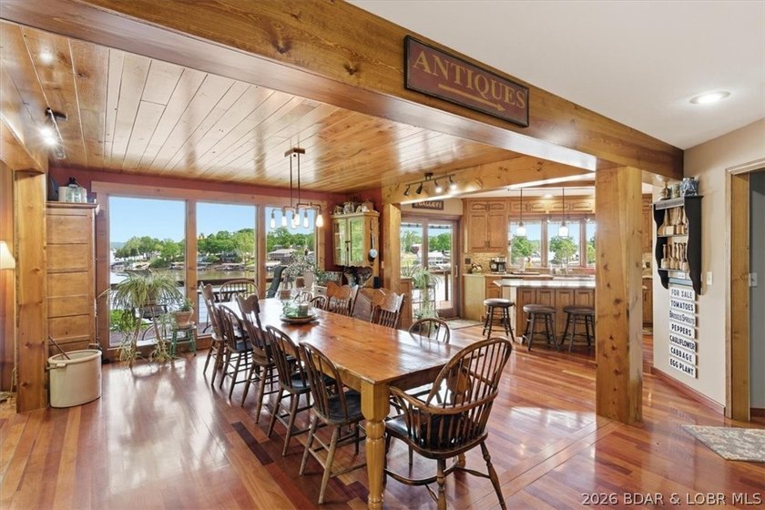 Vaulted ceilings, walls of windows, and wood-burning fireplace - photo 11