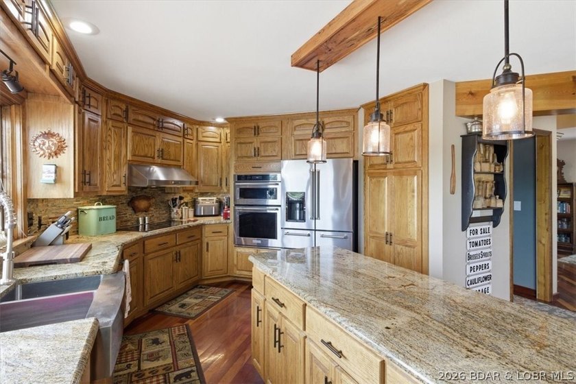Vaulted ceilings, walls of windows, and wood-burning fireplace - photo 14