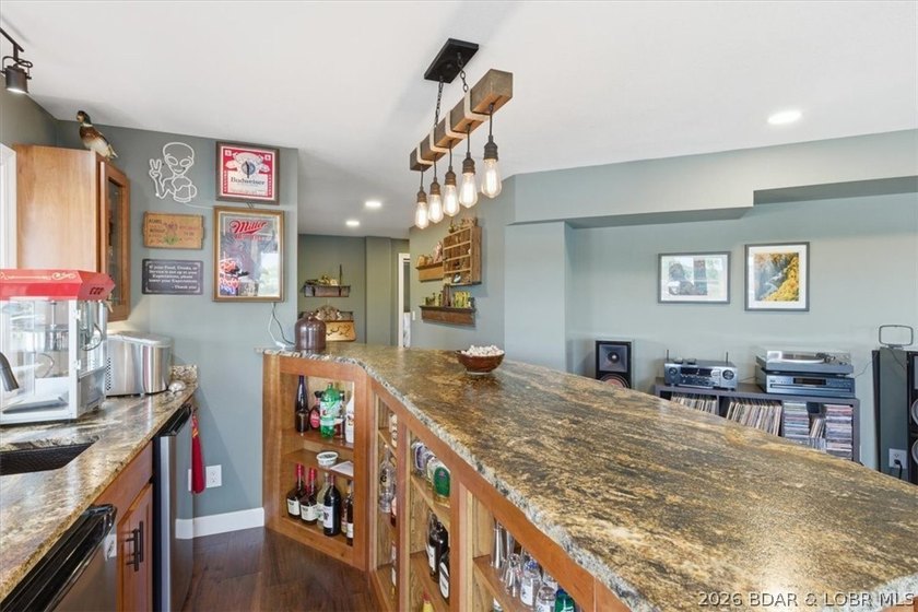 Vaulted ceilings, walls of windows, and wood-burning fireplace - photo 27