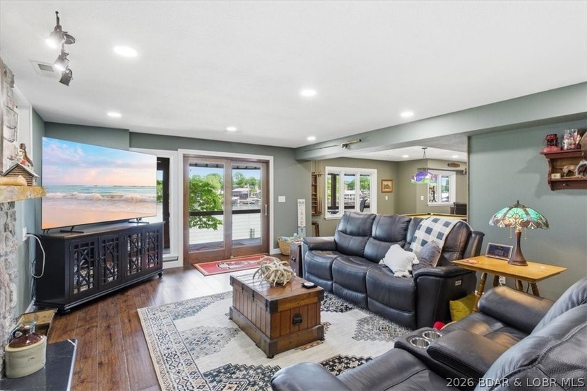 Vaulted ceilings, walls of windows, and wood-burning fireplace - photo 31