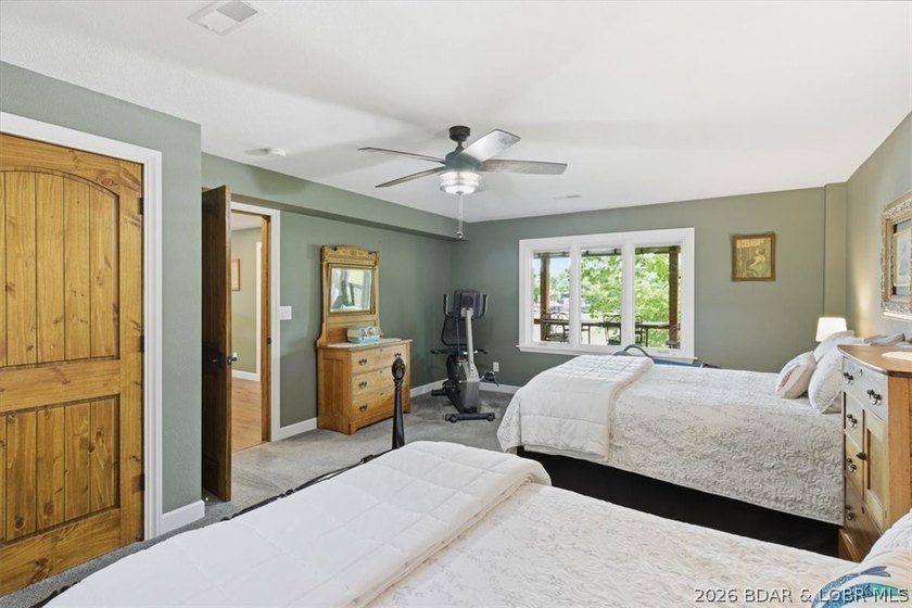Vaulted ceilings, walls of windows, and wood-burning fireplace - photo 34