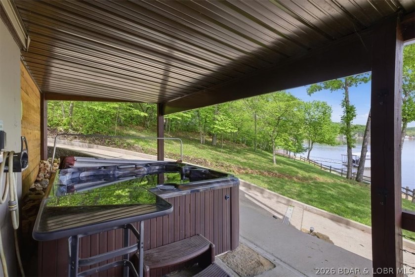 Vaulted ceilings, walls of windows, and wood-burning fireplace - photo 39