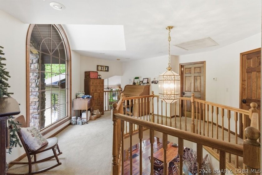 Vaulted ceilings, walls of windows, and wood-burning fireplace - photo 40