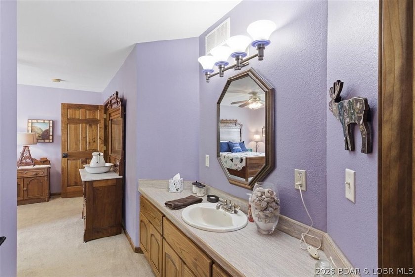 Vaulted ceilings, walls of windows, and wood-burning fireplace - photo 44