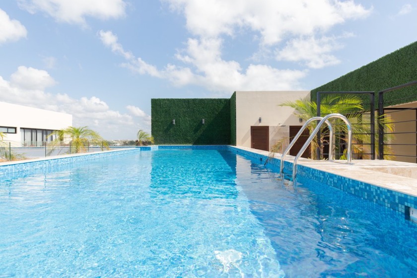 Discover the pinnacle of Tulum living in this beautiful - photo 3