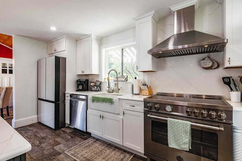 Thoughtfully and extensively renovated, this timeless farmhouse - photo 3
