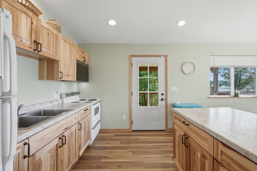 This beautiful four-year-old home on Little Blake Lake offers a - photo 13