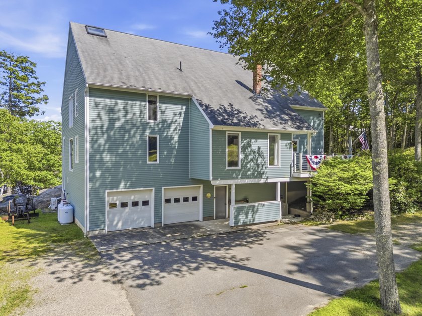 Nestled along the shore of the Kennebec River, this private 3BR - photo 3