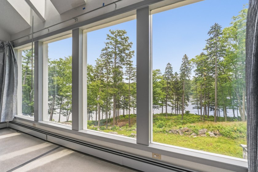 Nestled along the shore of the Kennebec River, this private 3BR - photo 4