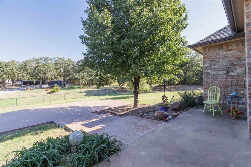 This cozy Medicine Park home has it all: Serene views of the - photo 7