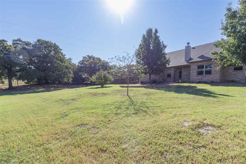 This cozy Medicine Park home has it all: Serene views of the - photo 10
