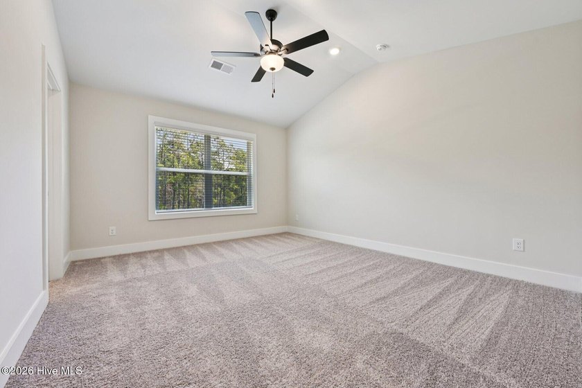 AVAILABLE NOW! This charming three-bedroom - photo 12