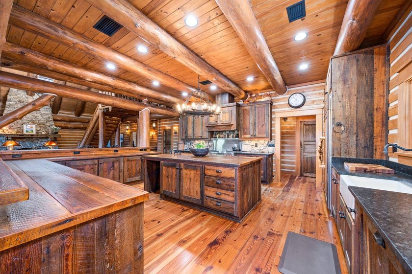 This riverfront property features an expansive, custom log home - photo 6