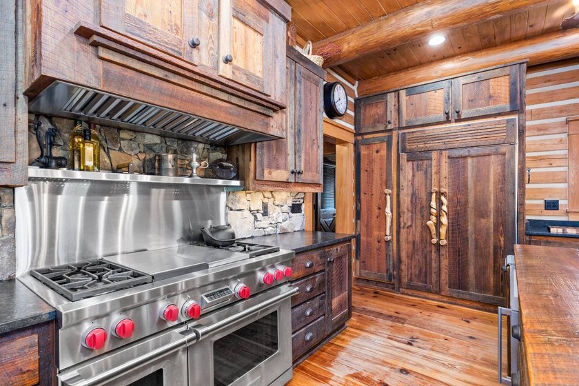 This riverfront property features an expansive, custom log home - photo 7