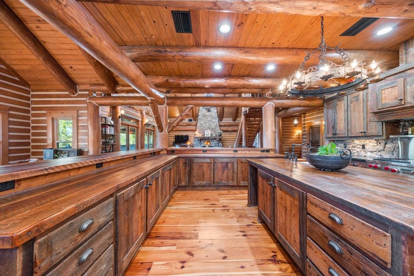 This riverfront property features an expansive, custom log home - photo 8
