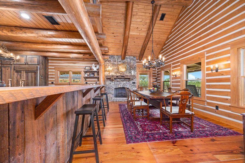 This riverfront property features an expansive, custom log home - photo 10