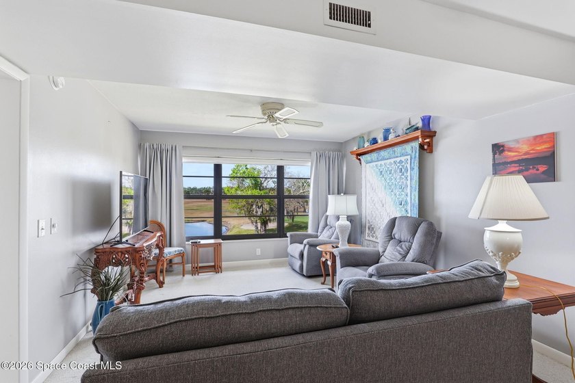 This beautifully updated 2bedroom 2bath condo offers serene pond - photo 3