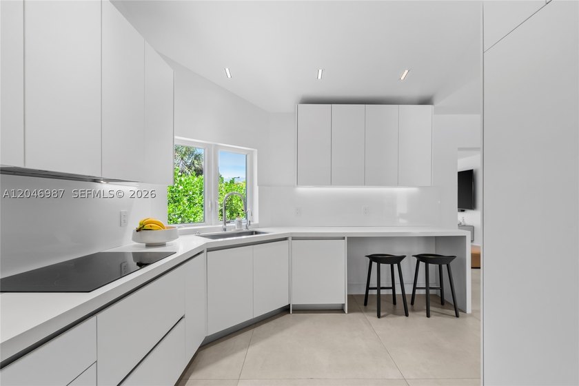 Step into this tastefully fully renovated 4 bedroom, 3.5 - photo 11