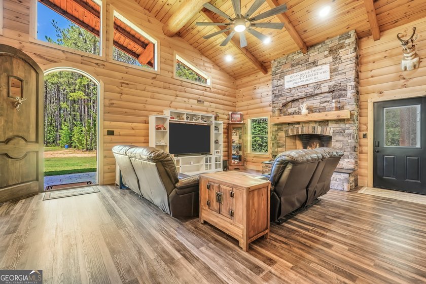 Beautifully custom-built log cabin style home privately situated - photo 11