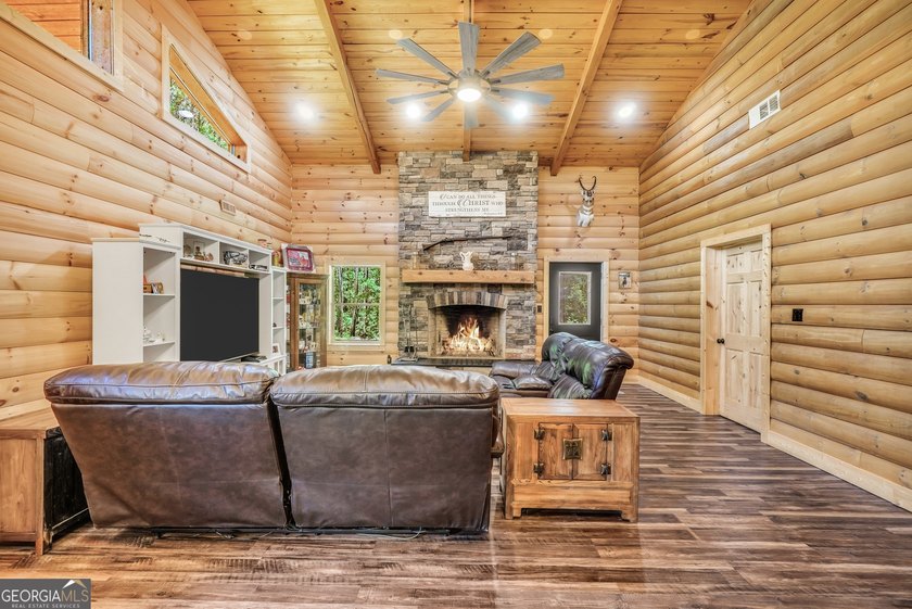 Beautifully custom-built log cabin style home privately situated - photo 14