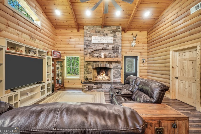 Beautifully custom-built log cabin style home privately situated - photo 15