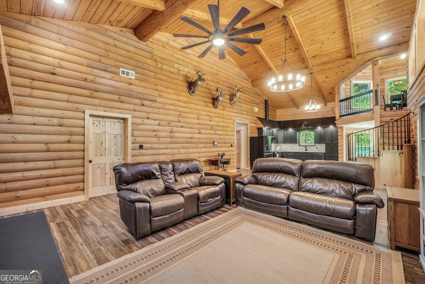 Beautifully custom-built log cabin style home privately situated - photo 16